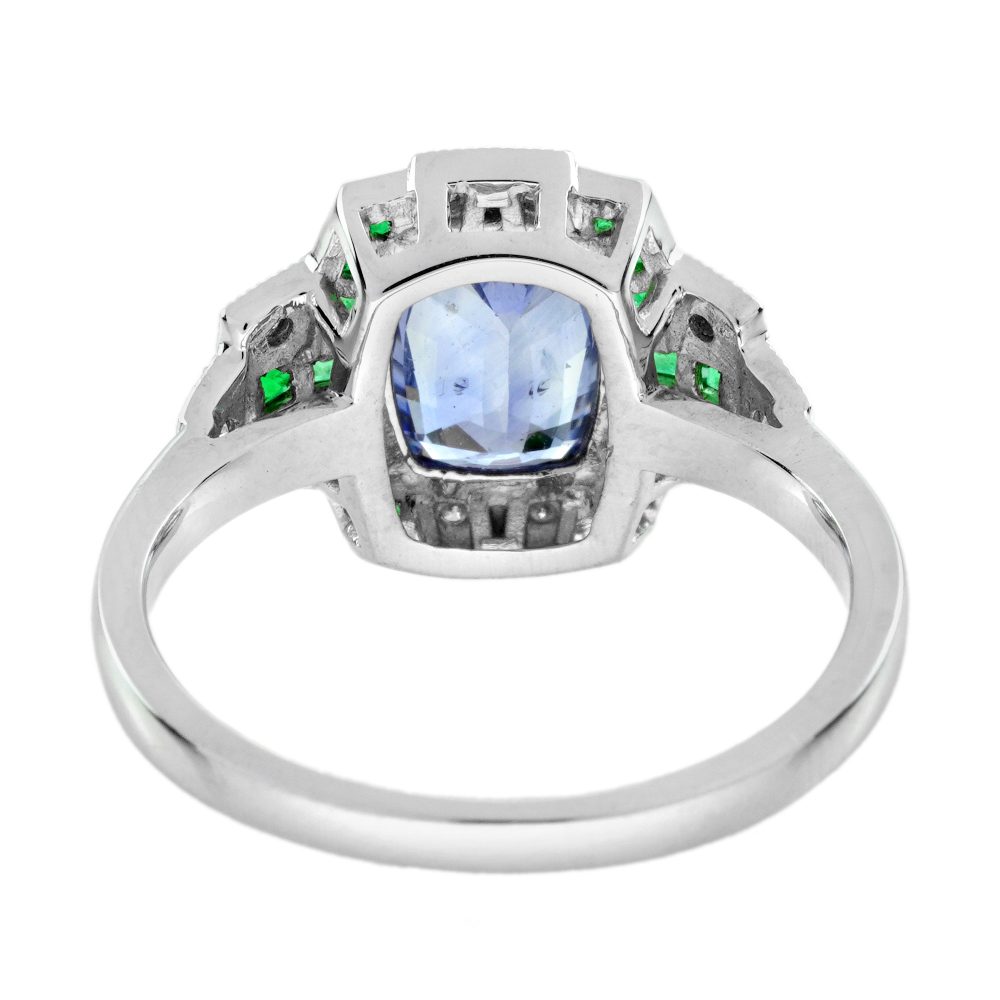 1.60ct Ceylon Sapphire Emerald and Diamond Engagement Ring, cushion-shape certified Ceylon sapphire flanked by vibrant green emeralds accented with diamonds in geometric detailing in 18ct white gold