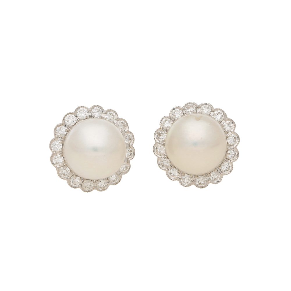 Pearl and diamond cluster earrings in white gold.