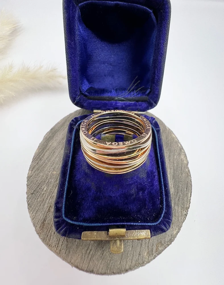 Omega Ladymatic ring in three colour gold.