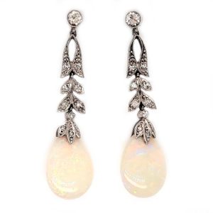 Edwardian Antique Opal and Diamond Drop Earrings, Diamond tops suspend floral diamond leaf designs with trefoil diamond caps holding pear drop opals