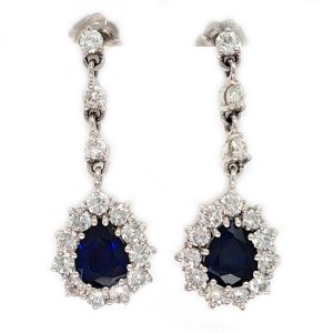 Vintage Pear Cut Royal Blue Sapphire and Diamond Cluster Drop Earrings in 18ct White Gold, teardrop pear-shaped Royal blue sapphires with brilliant-cut diamond borders suspended from a row of three diamonds Circa 1960s