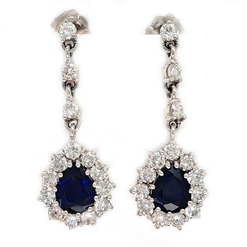 Vintage Pear Cut Royal Blue Sapphire and Diamond Cluster Drop Earrings in 18ct White Gold, teardrop pear-shaped Royal blue sapphires with brilliant-cut diamond borders suspended from a row of three diamonds Circa 1960s