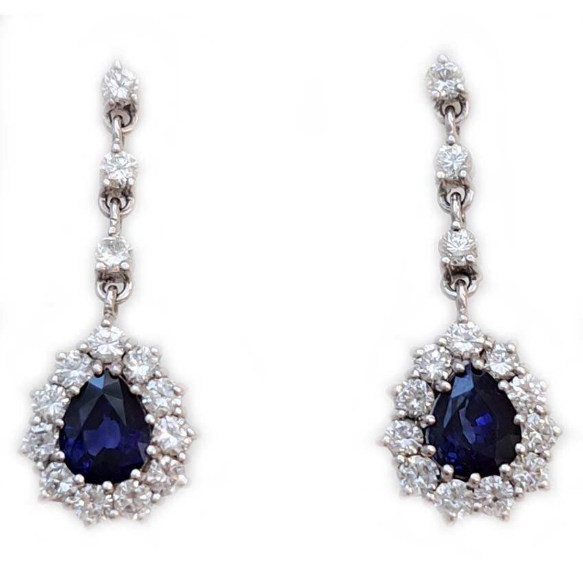 Vintage Pear Cut Royal Blue Sapphire and Diamond Cluster Drop Earrings in 18ct White Gold, teardrop pear-shaped Royal blue sapphires with brilliant-cut diamond borders suspended from a row of three diamonds Circa 1960s