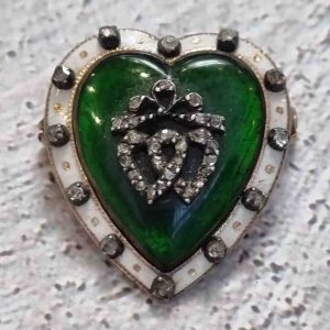 Victorian Antique Green and White Enamel Heart Brooch with Diamonds, two entwined rose-cut diamond hearts topped with bow in green enamel panel within a white enamel outer border accented with old mine-cut diamonds in 18ct yellow gold. English, Late 19th century Circa 1870