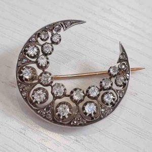 Victorian Antique 1ct Old Cut Diamond Crescent Moon Brooch, set with old mine-cut, single-cut and rose-cut diamonds in silver to yellow gold. Late 19th century Circa 1890