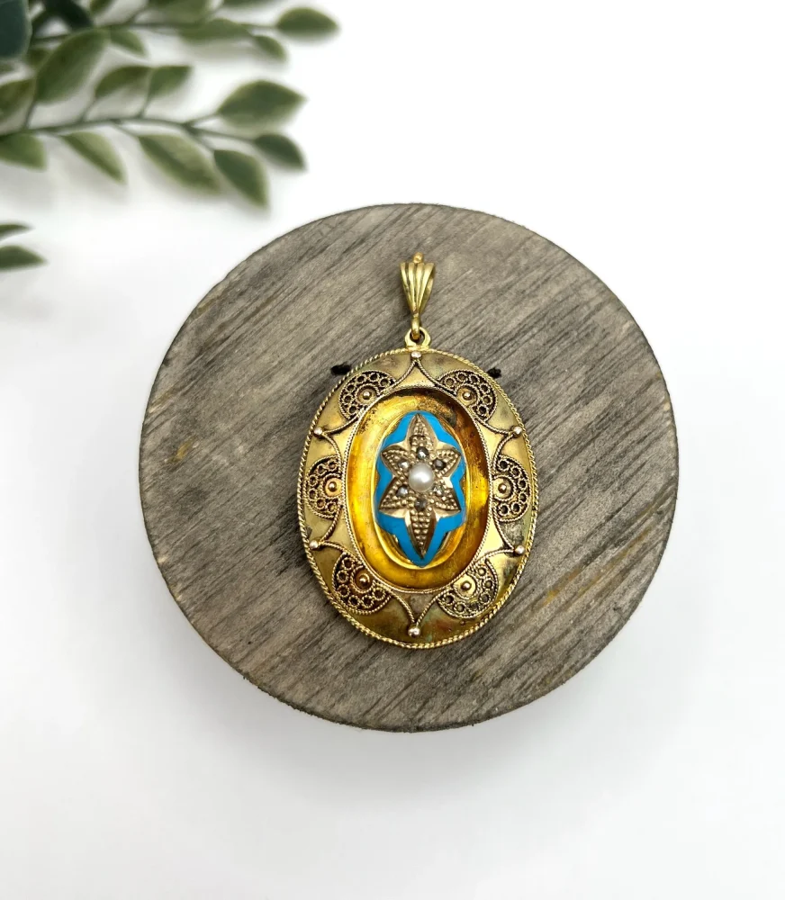 Antique gold locket/pendant with enamel and gemstones.
