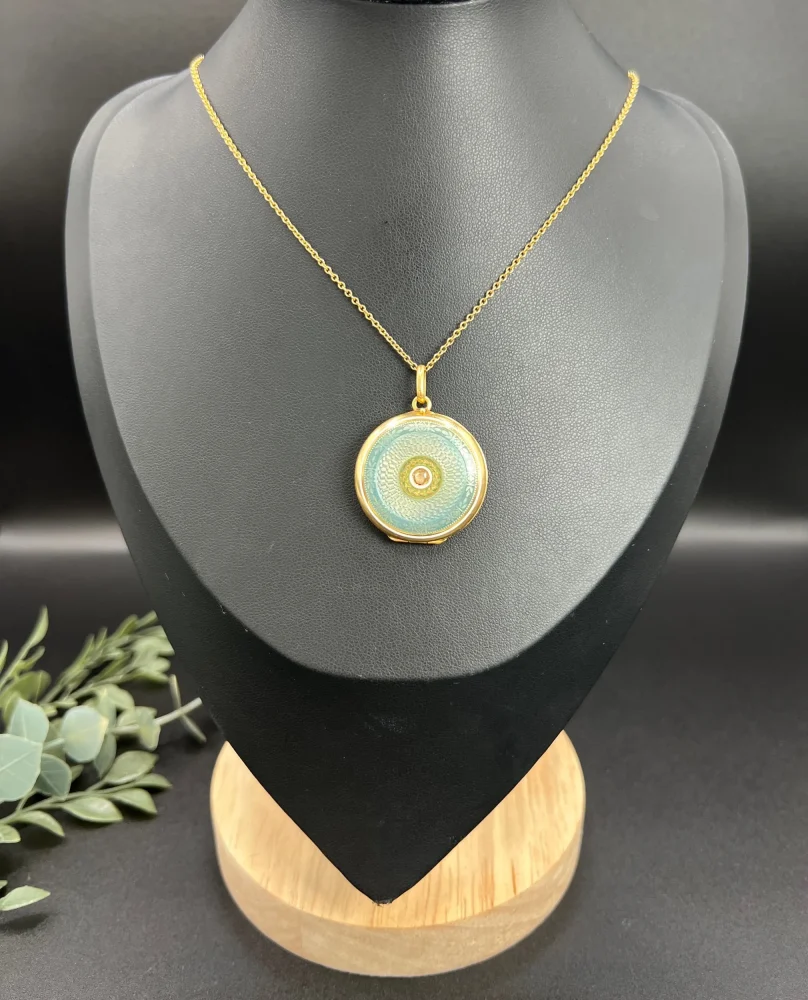 Edwardian enamel and diamond locket in gold.