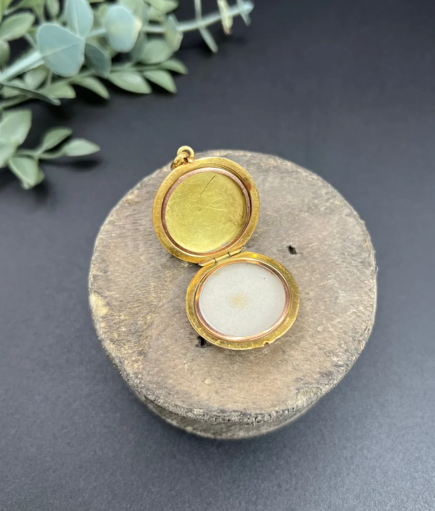 Edwardian enamel and diamond locket in gold.