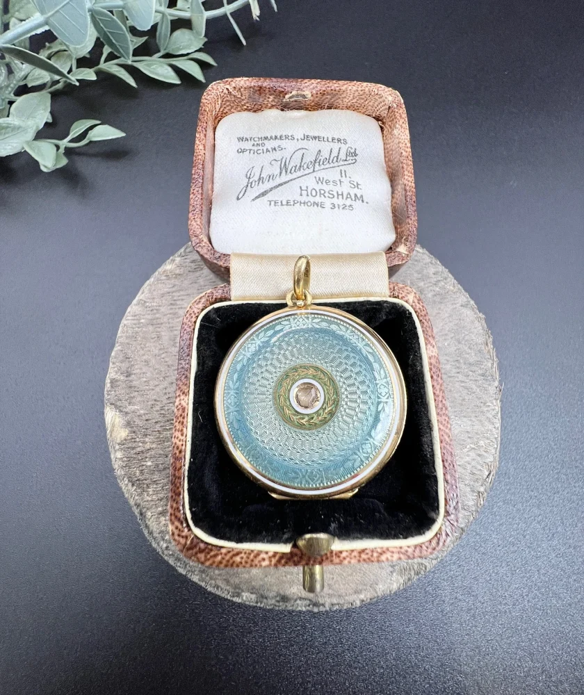 Edwardian enamel and diamond locket in gold.