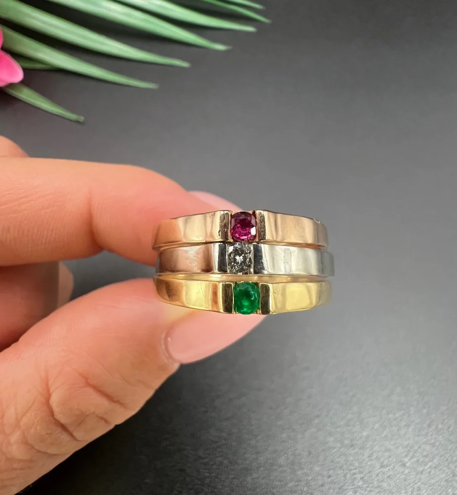 Gold stacking ring with emerald diamond and ruby.