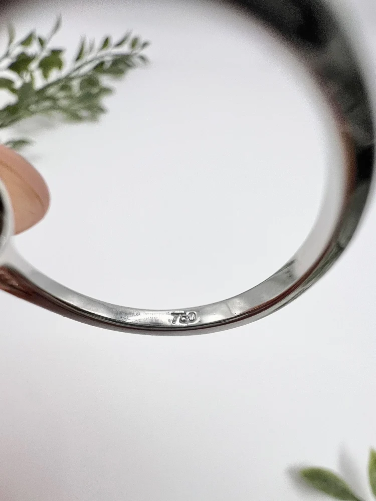 Emerald and diamond ring in white gold.