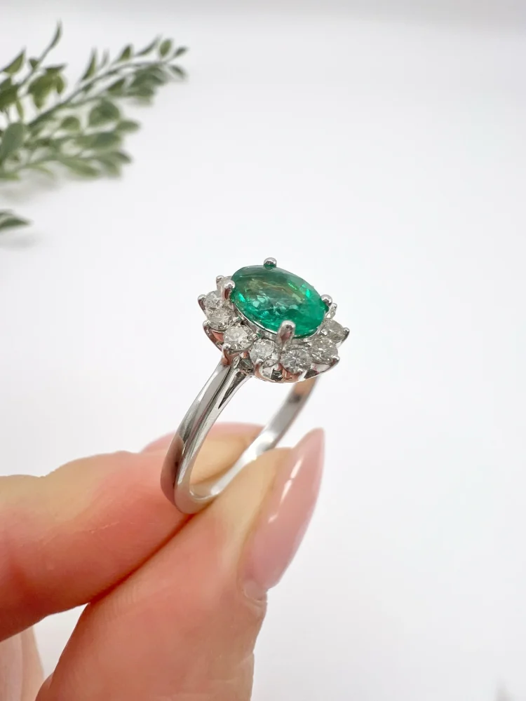 Emerald and diamond ring in white gold.