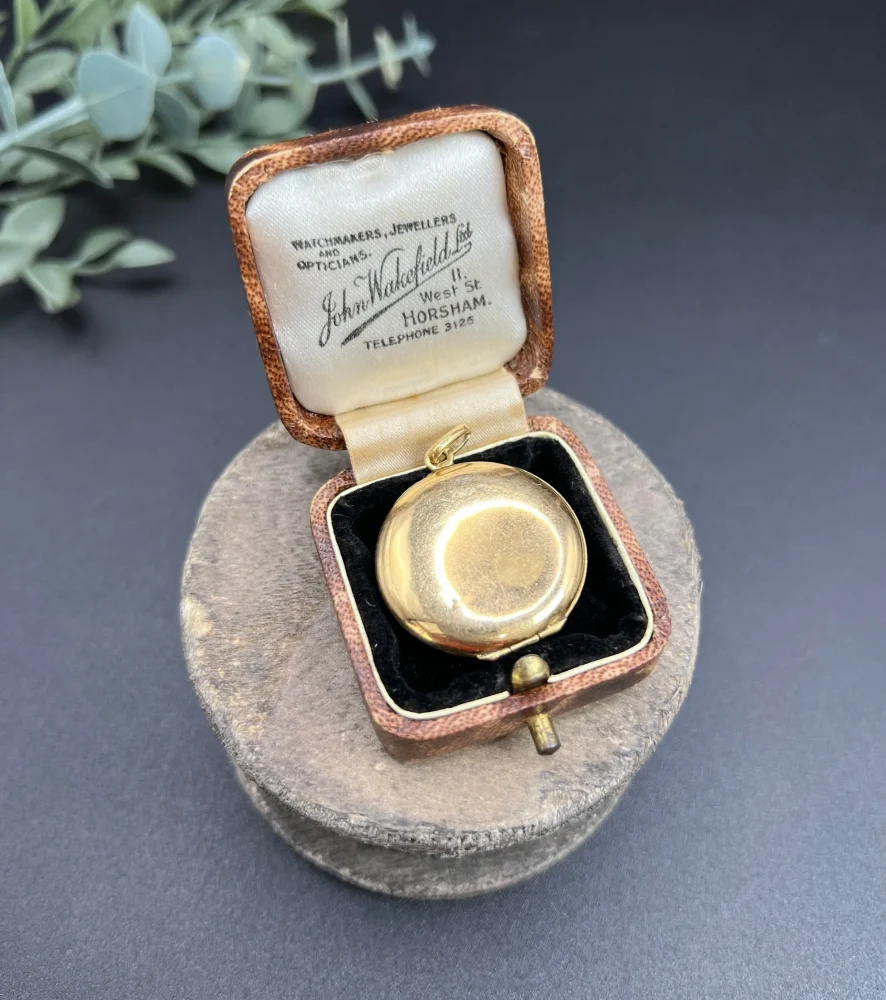 Edwardian enamel and diamond locket in gold.