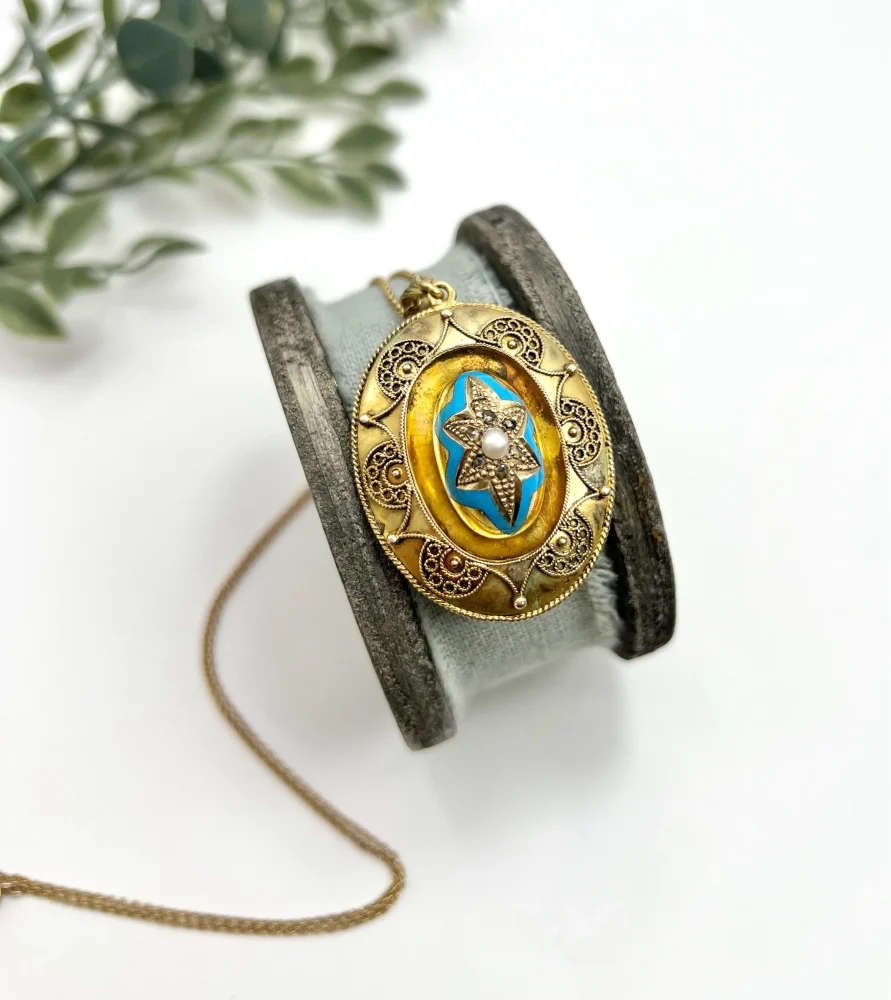 Antique gold locket/pendant with enamel and gemstones.