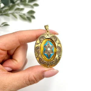 Antique gold locket/pendant with enamel and gemstones.