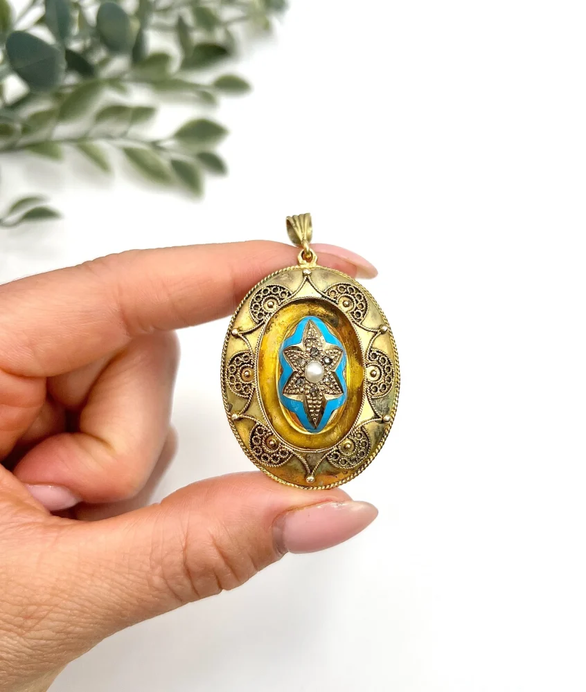 Antique gold locket/pendant with enamel and gemstones.