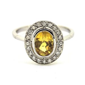 1.90ct Oval Yellow Sapphire and Diamond Halo Cluster Engagement Ring in Platinum