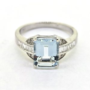 Contemporary Aquamarine and Diamond Engagement Ring in White Gold,l 1.74ct emerald-cut aquamarine flanked by baguette-cut diamond shoulders accented with brilliant-cut diamonds