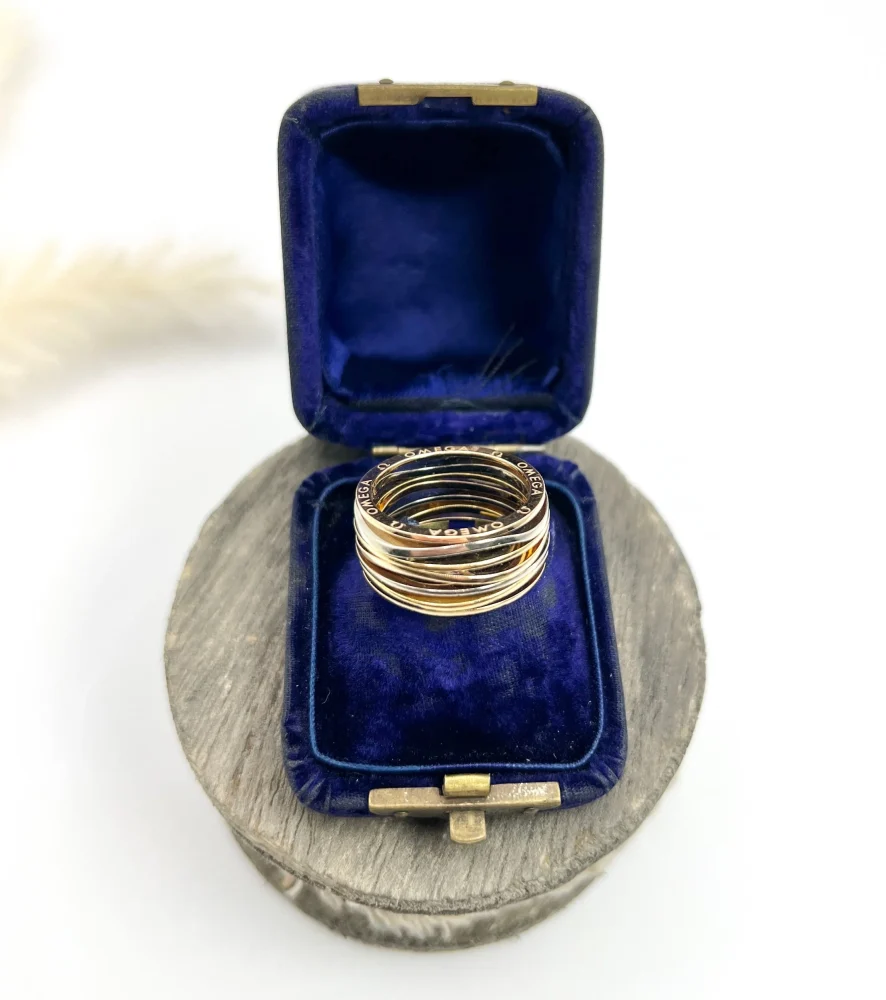 Omega Ladymatic ring in three colour gold.