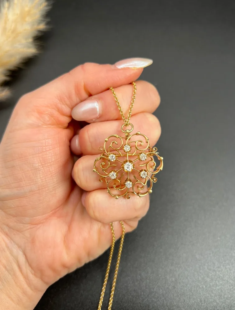 Edwardian diamond snowflake brooch in gold.