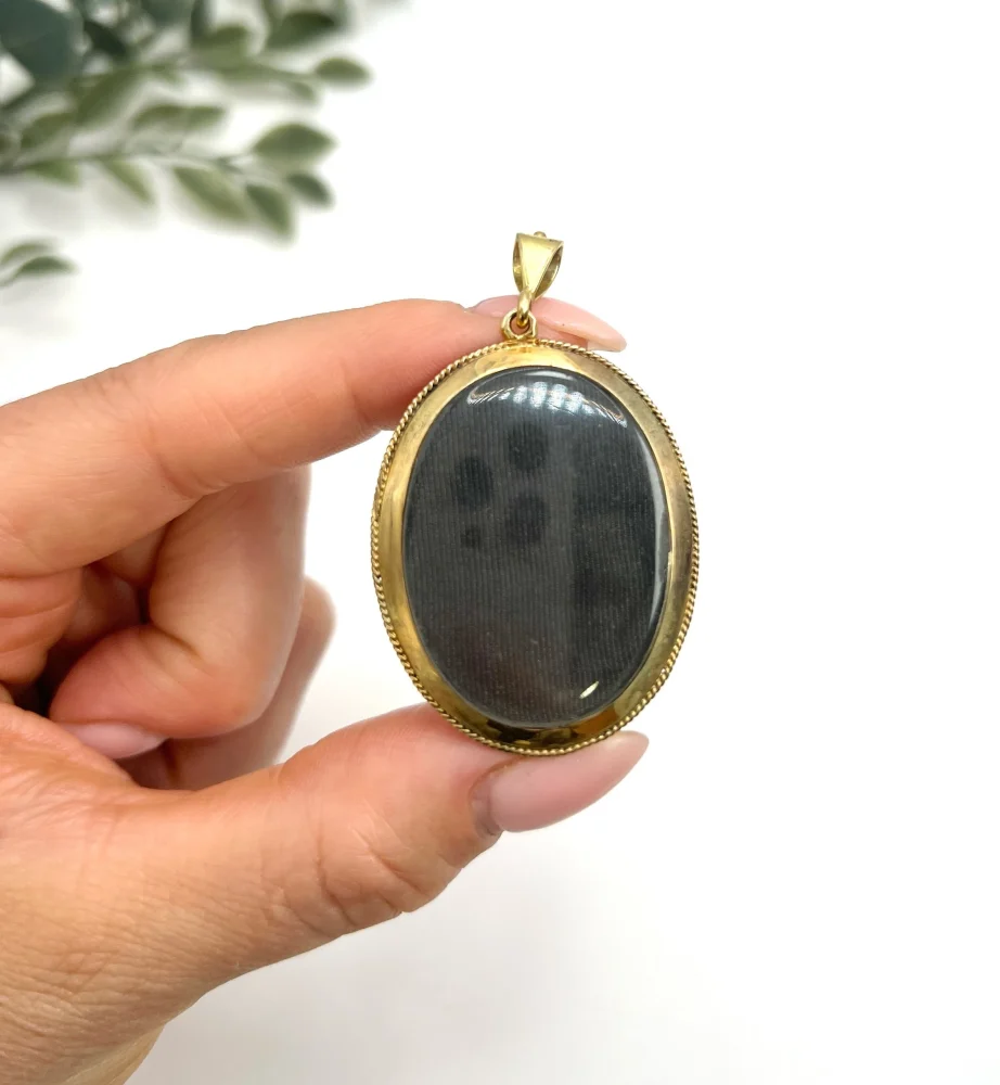 Antique gold locket/pendant with enamel and gemstones.