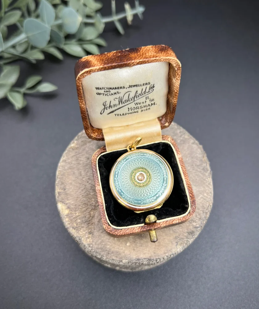 Edwardian enamel and diamond locket in gold.