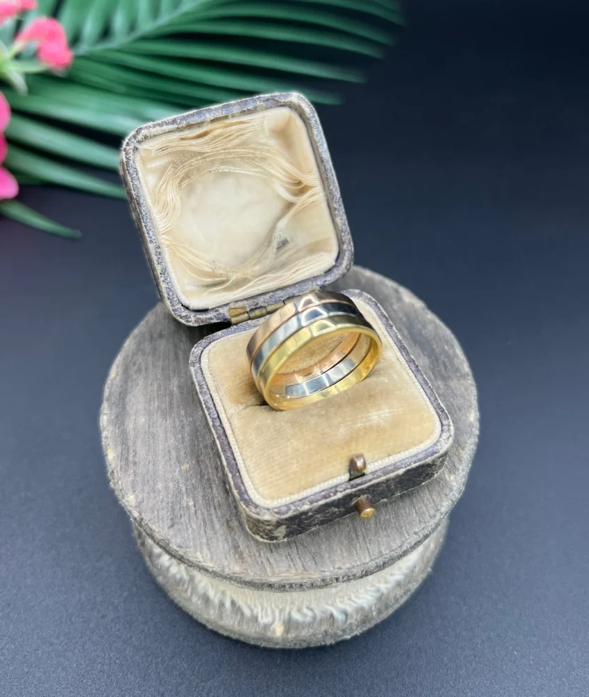 Gold stacking ring with emerald diamond and ruby.