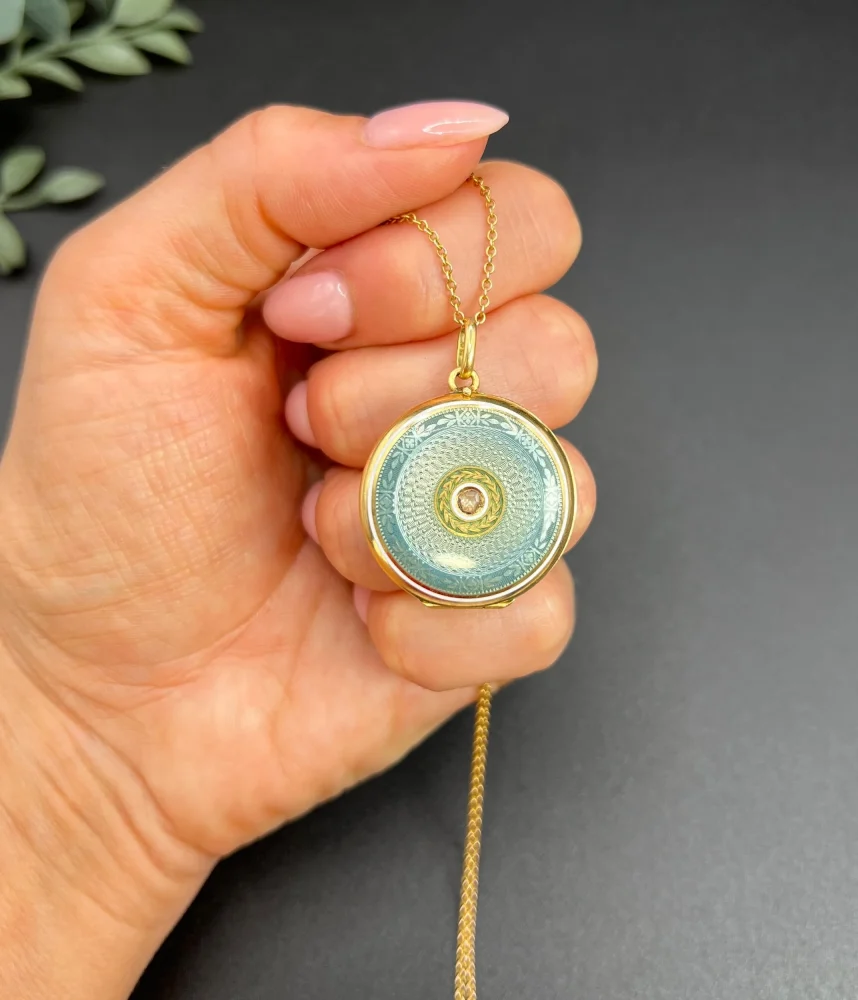 Edwardian enamel and diamond locket in gold.