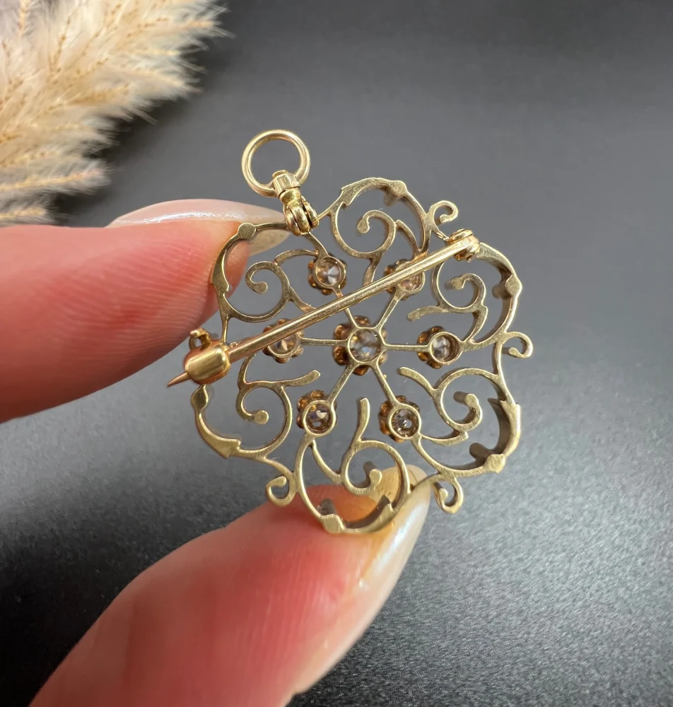 Edwardian diamond snowflake brooch in gold.