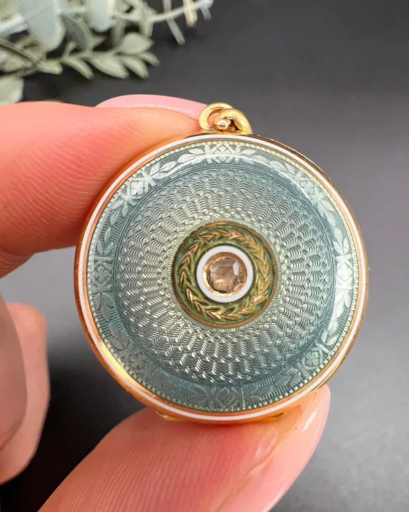 Edwardian enamel and diamond locket in gold.