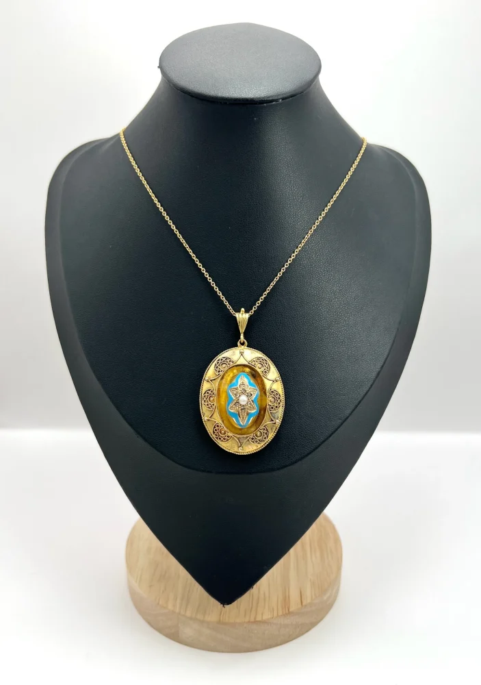 Antique gold locket/pendant with enamel and gemstones.