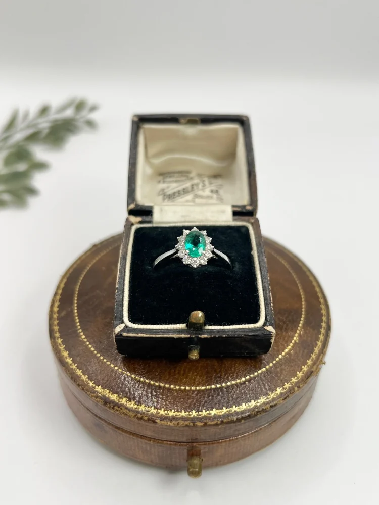 Emerald and diamond ring in white gold.