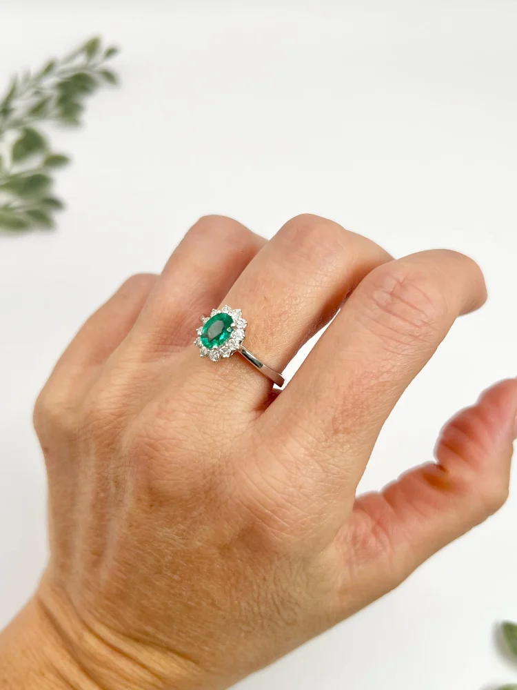 Emerald and diamond ring in white gold.