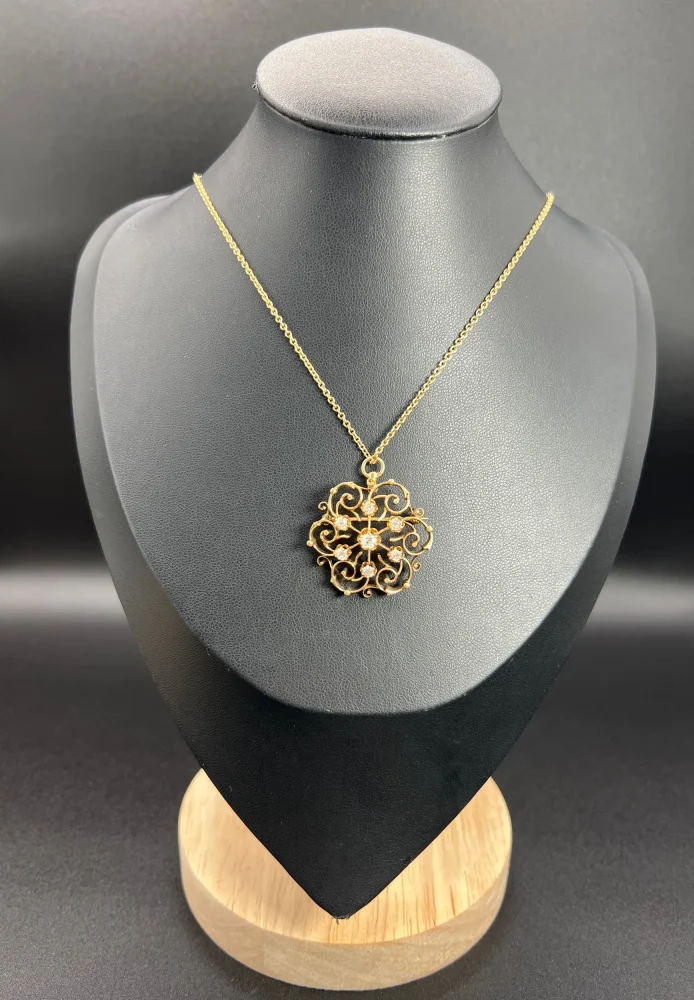 Edwardian diamond snowflake brooch in gold.