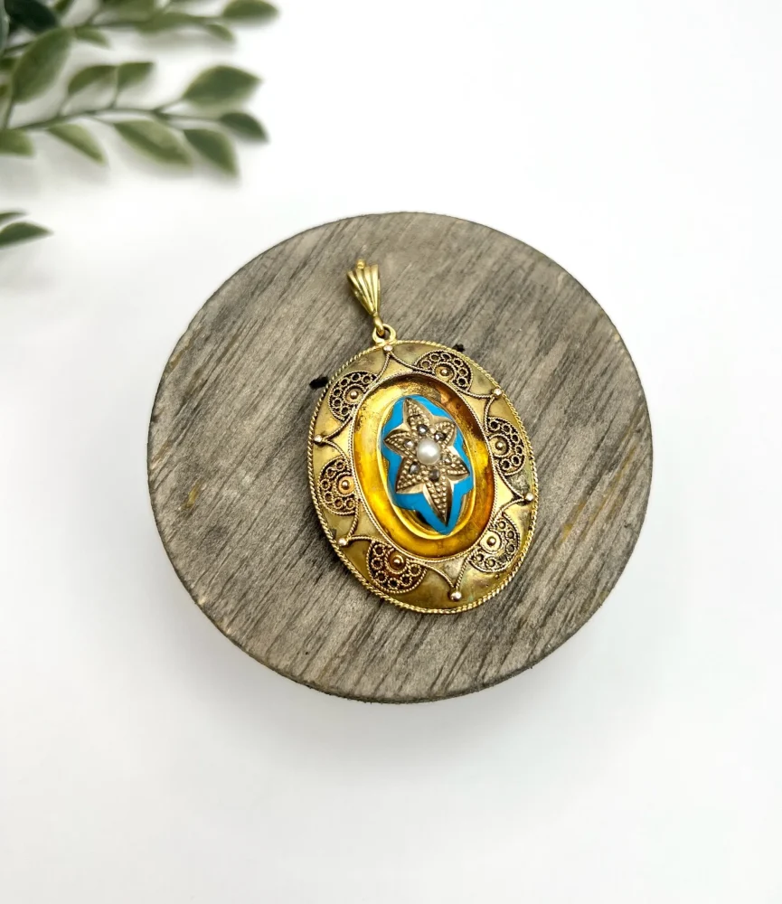 Antique gold locket/pendant with enamel and gemstones.