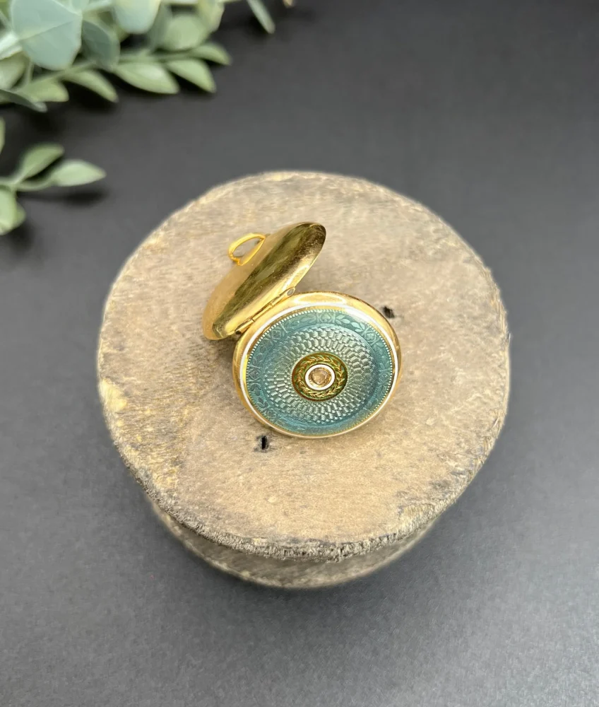 Edwardian enamel and diamond locket in gold.