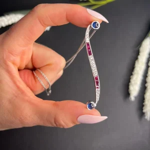 Contemporary white gold pendant with gemstones.