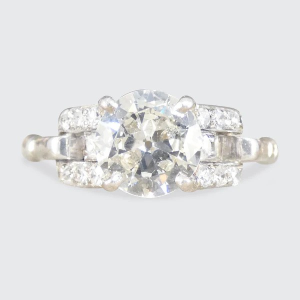 Vintage 1.12 Carat Diamond Ring With Diamond Set Staged Shoulders In Platinum
